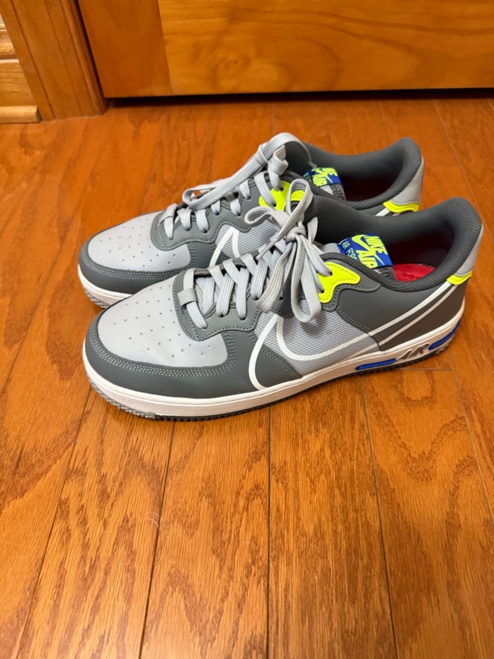 Nike Gray Low-Top Sneakers with Neon Yellow and Blue Accents